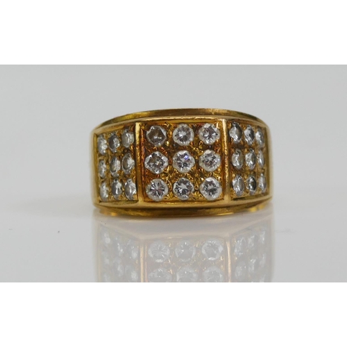 99 - An 18ct Gold and Diamond Ring, set with 2.3mm brilliant cuts arranged in three panels of nine, size ... 