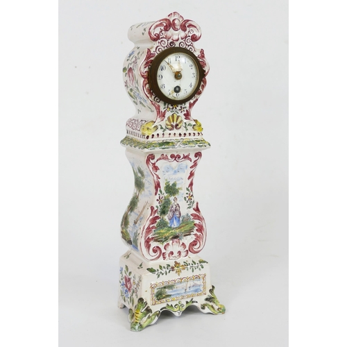 1342 - A continental faience miniature model of pedestal timepiece, with 5cm Arabic dial, decorated with ri... 