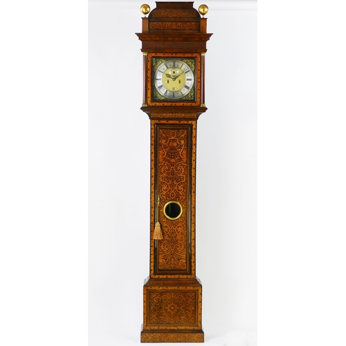 John Webster, London, an early 18th century walnut and marquetry longcase clock, the hood with triple caddy top and ball finials, the trunk with arabesque marquetry inlaid door with circular glazed panel, on a box base, the 30cm  square brass dial with silvered chapter ring signed John Webster, London, with subsidiary seconds dial and date aperture, The eight day twin train movement with five turned pillars, striking to a bell, having pull repeat, 244cm high.