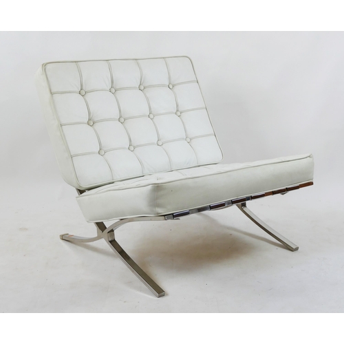 1457 - A Barcelona style easy chair with white faux leather button down cushions on a chrome frame.