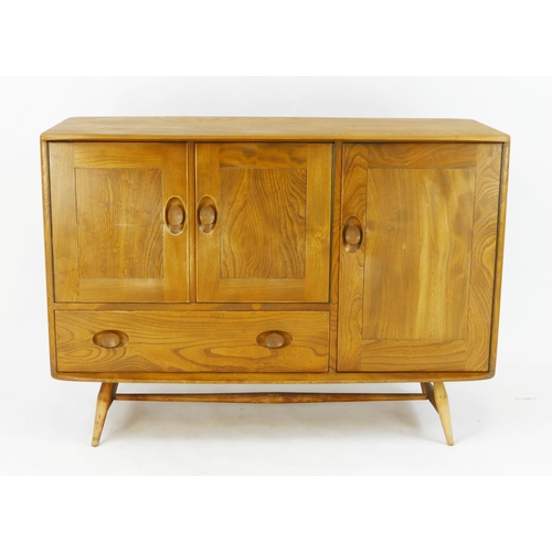 1459 - Ercol - elm and beech sideboard, fitted with cupboards and single drawer, enclosed by panelled doors... 