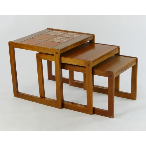 1462 - A nest of three G-Plan style teak tiled top tables,