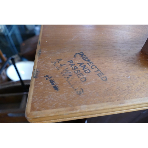 1466 - A 1960's/70's teak rectangular coffee table, raised on four swept legs linked by an X-frame stretche... 