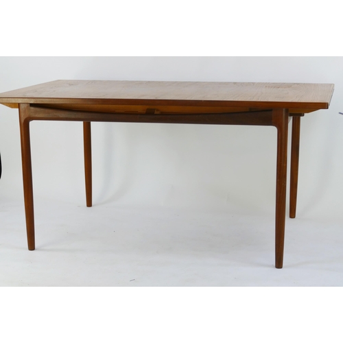 1469 - A G-Plan dining table to a Kofod Larsen design, extending dining table, the rectangular top raised o... 