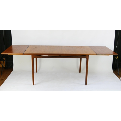 1469 - A G-Plan dining table to a Kofod Larsen design, extending dining table, the rectangular top raised o... 