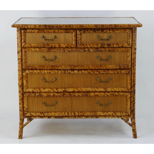 1473 - A modern bamboo and rattan chest of drawers of rectangular outline, containing two short and three l... 