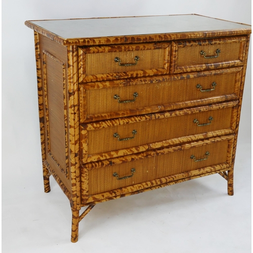 1473 - A modern bamboo and rattan chest of drawers of rectangular outline, containing two short and three l... 