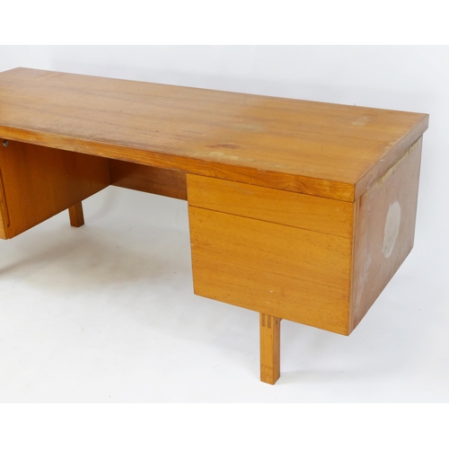 1476 - An 1960's Air Ministry teak twin pedestal desk, containing three short drawers and a cupboard door, ... 