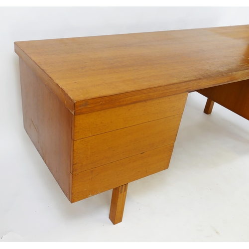 1476 - An 1960's Air Ministry teak twin pedestal desk, containing three short drawers and a cupboard door, ... 