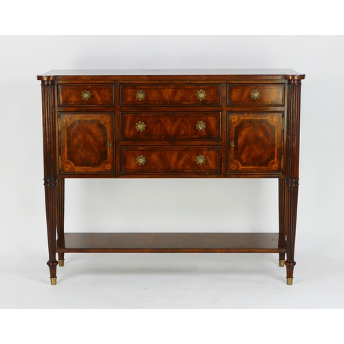 1487 - A Theodore Alexander mahogany and crossbanded sideboard, with rectangular top with three central sho... 