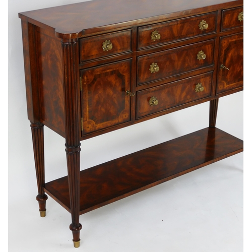 1487 - A Theodore Alexander mahogany and crossbanded sideboard, with rectangular top with three central sho... 