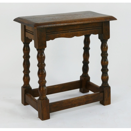 1489 - A reproduction oak joynt stool, with rectangular top, raised on turned and block legs. linked by str... 