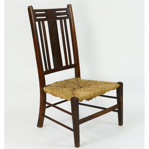 1492 - A Liberty style nursing chair, with bar back the central splat with inlaid decoration with sisal sea... 