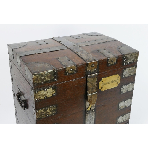 1500 - A 19th century oak and metal bound campaign/travel chest, with applied brass plaque inscribed Colone... 