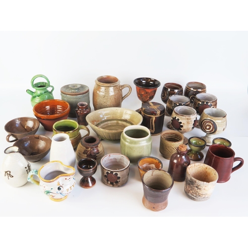 1511 - A collection of assorted studio ceramics including bowls, beakers and goblets.