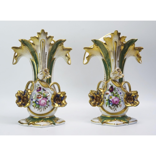 1528 - A pair of continental porcelain vases, of foliate design, with painted floral decoration  heightened... 