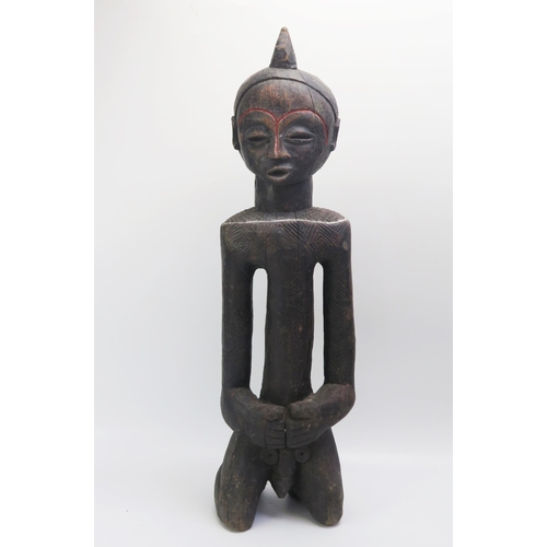 1534 - An African Luba Carved Wooden Figure of a Kneeling Male, 69cm