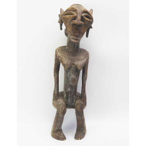 1535 - An African Luba Carved Wooden Figure of an Elderly Female with mask to the back, 48cm