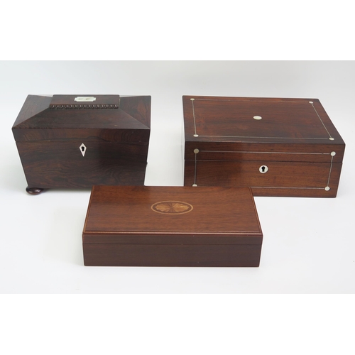 1542 - A 19th century rosewood tea caddy of sarcophagus outline, 23cm wide, together with two mahogany boxe... 