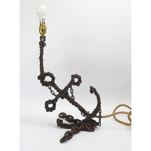 1544 - A table lamp with motorcycle chain stem on a link chain base, overall height 48cm.