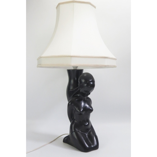 1545 - A Dartmouth pottery table lamp in the form of a kneeling African female.