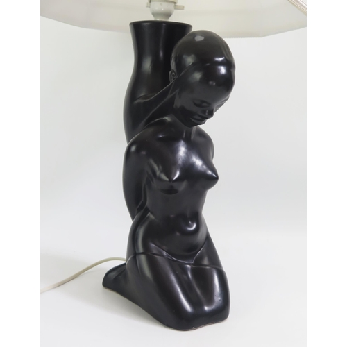 1545 - A Dartmouth pottery table lamp in the form of a kneeling African female.