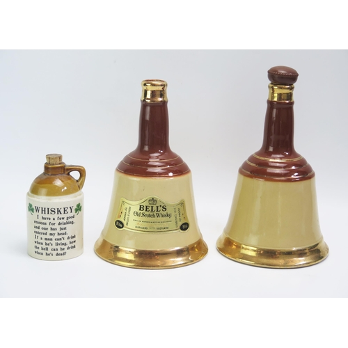 1549 - Two Wade Bells Whisky bottles and a small stoneware whiskey flagon, all empty.