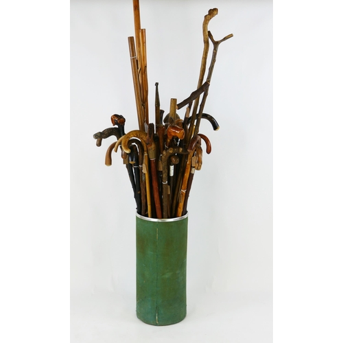 1555 - A collection of assorted bentwood, bamboo, Malacca and other walking sticks, boat hook contained in ... 