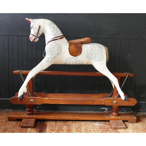 1563 - A large late Victorian repainted dappled rocking horse, with pricked ears, glass eyes, flared nostri... 