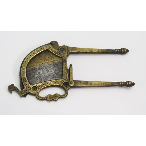 1567 - An Indo-Persian brass and steel betel nut cutter, of traditional design,