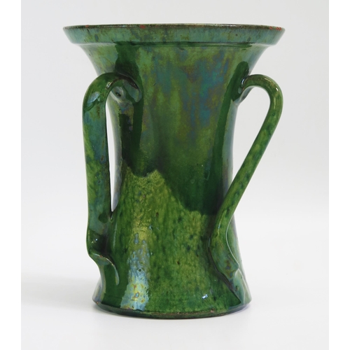 1575 - An Arts & Craft period pottery three handled vase, with variegated green glazes, possibly by the Dic... 