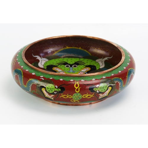 1592 - A Chinese cloisonné bowl decorated with dragons chasing pearls of knowledge, 25cm diameter.