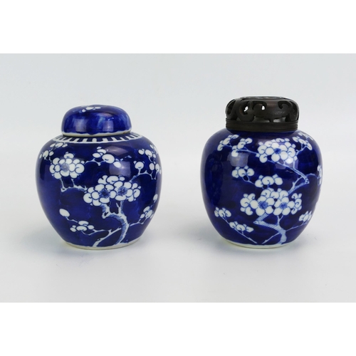 1595 - Two Chinese blue and white prunus decorated ginger jars and covers, 13cm high