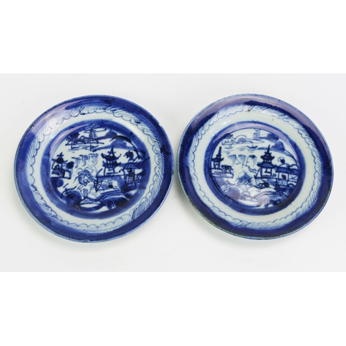 1595A - A pair of Chinese provincial blue and white plates decorated with a village landscapes, 15cm diamete... 