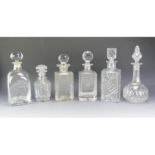 1603 - A collection of six assorted clear glass decanters and stoppers, various shapes and sizes. (6).