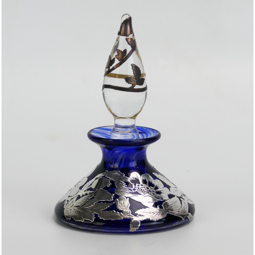 1605A - A Blue glass and silver mounted scent bottle and stopper of squat circular form, 12cm high.