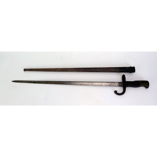 1611 - A late 19th century French Gras bayonet, with 52cm T-shaped blade dated 1880,  wood grips contained ... 