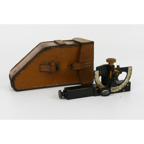 1634 - H Steward Ltd, an anodised brass inclinometer, contained in a stitched leather case.