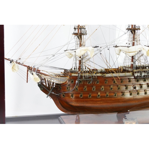 1638 - A hand built model of HMS Victory, with planked hull, simulated planked decking, cannons and life bo... 