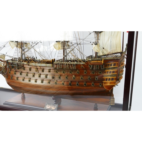 1638 - A hand built model of HMS Victory, with planked hull, simulated planked decking, cannons and life bo... 