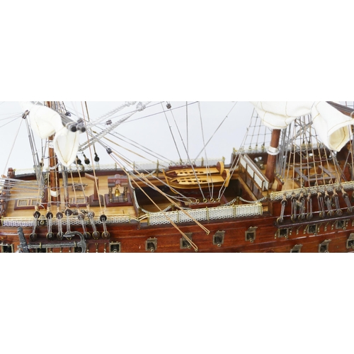 1638 - A hand built model of HMS Victory, with planked hull, simulated planked decking, cannons and life bo... 