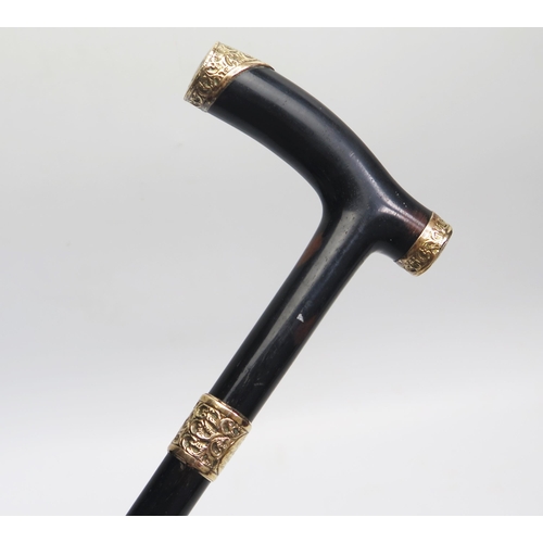 1644 - An ebonised and 18ct gold plated mounted walking stick, with presentation inscription, marked 18CT G... 