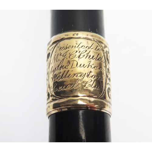 1644 - An ebonised and 18ct gold plated mounted walking stick, with presentation inscription, marked 18CT G... 