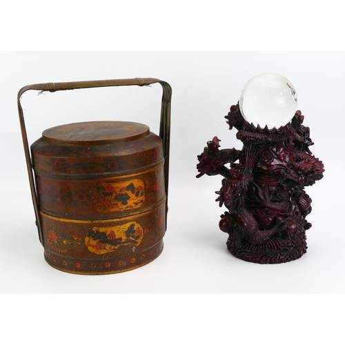 1649 - A 20th century Chinese lacquered two division food container of cylindrical outline with loop carryi... 