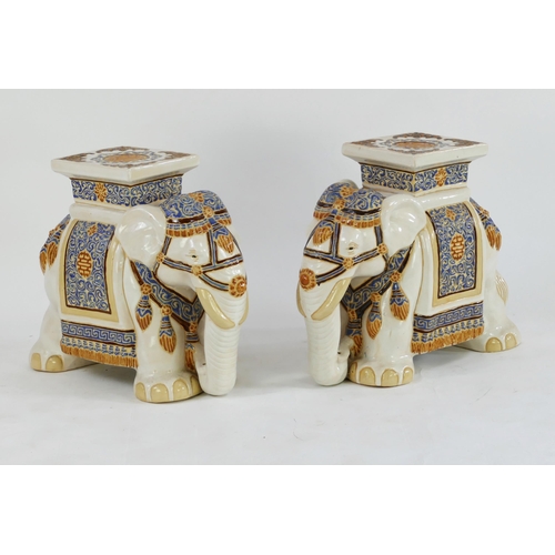 1652 - A pair of modern Chinese jardinière stands in the form of elephants dressed in robes, 50cm long, 41c... 