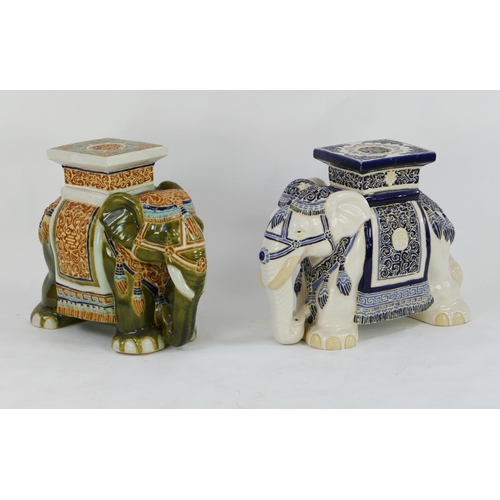 1653 - Two modern Chinese jardinière stands in the form of elephants dressed in robes, with polychrome deco... 