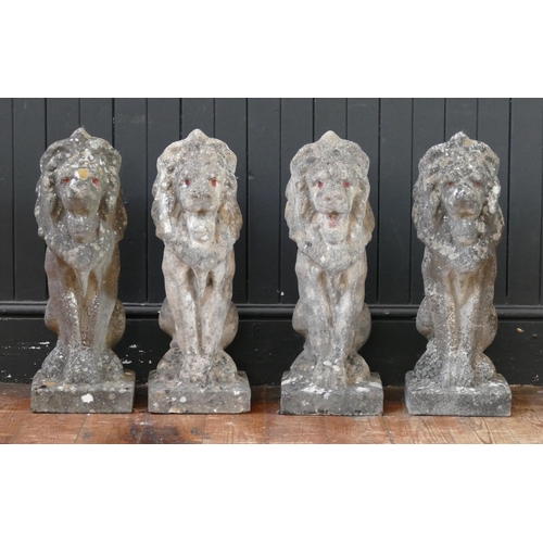 1659 - A set of four reconstituted stone lions sejant, mounted on rectangular base, 57cm high. (4).