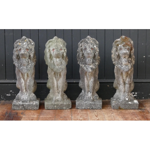 1659A - A set of four reconstituted stone lions sejant, mounted on rectangular base, 57cm high. (4).