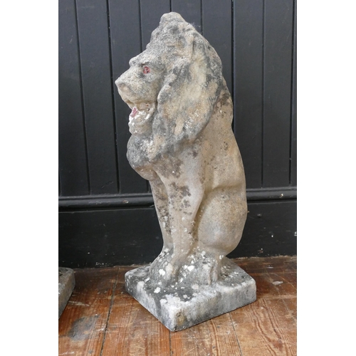 1660 - A set of four reconstituted stone lions sejant, mounted on rectangular base, 57cm high. (4).