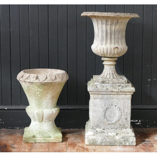 1666 - A reconstituted stone urn of campana form, raised on a plinth base, 87cm high together with another ... 